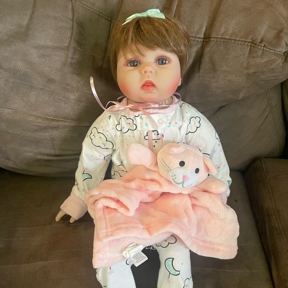 Adorable life size vinyl and cloth baby doll